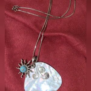 Silver and Blue Sunburst Pendant Necklace